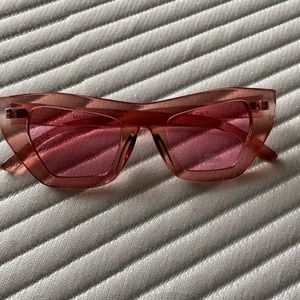 Pink sunglasses with pink frames